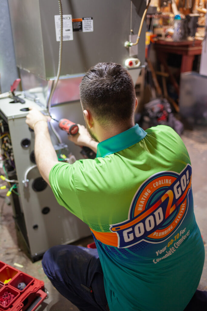 Good2Go HVAC technician performing a professional furnace tune-up to ensure safe and efficient heating in a South Jersey home.
